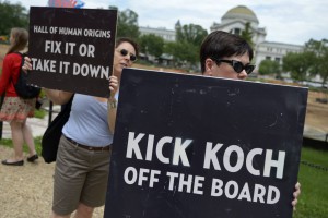 epa04801355 Protesters chant in front of the Smithsonian Castle during a rally against board member David Koch in Washington, DC, USA, 15 June 2015. They called on the institution to kick oil mogul and climate change denier David H. Koch off of their advisory board and fire physicist Dr. Willie Soon, who took over $1 million from fossil fuel interests in exchange for publishing scientific reports denying human impact on climate change. EPA/SHAWN THEW